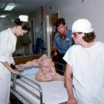 Alexandra Auder, Brian Fitzpatrick, and Kevin Van Hentenryck check Belial's condition.