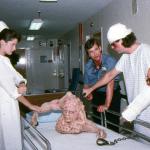 Alexandra Auder, Brian Fitzpatrick, and Kevin Van Hentenryck check Belial's condition.