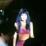 Peter Clark adjusts camera as Patty Mullen laughs. 