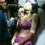 Dan Frye touches up Patty Mullen's makeup on the mad lab set. 