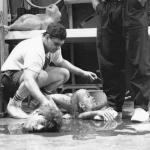 Gabe Bartalos prepares for the invasion of the body parts. Joe Gonzalez stands while Jeffrey's severed head watches. 