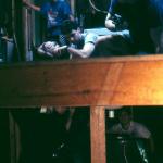 Billy Messina attends to the "titty-twister" as the puppeteers ready themselves beneath. The garbage bags they're wearing is to protect them from the purple goop on the floor of the set. 