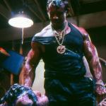 Joe Gonzalez holding two of the creatures that just "attacked" him. 